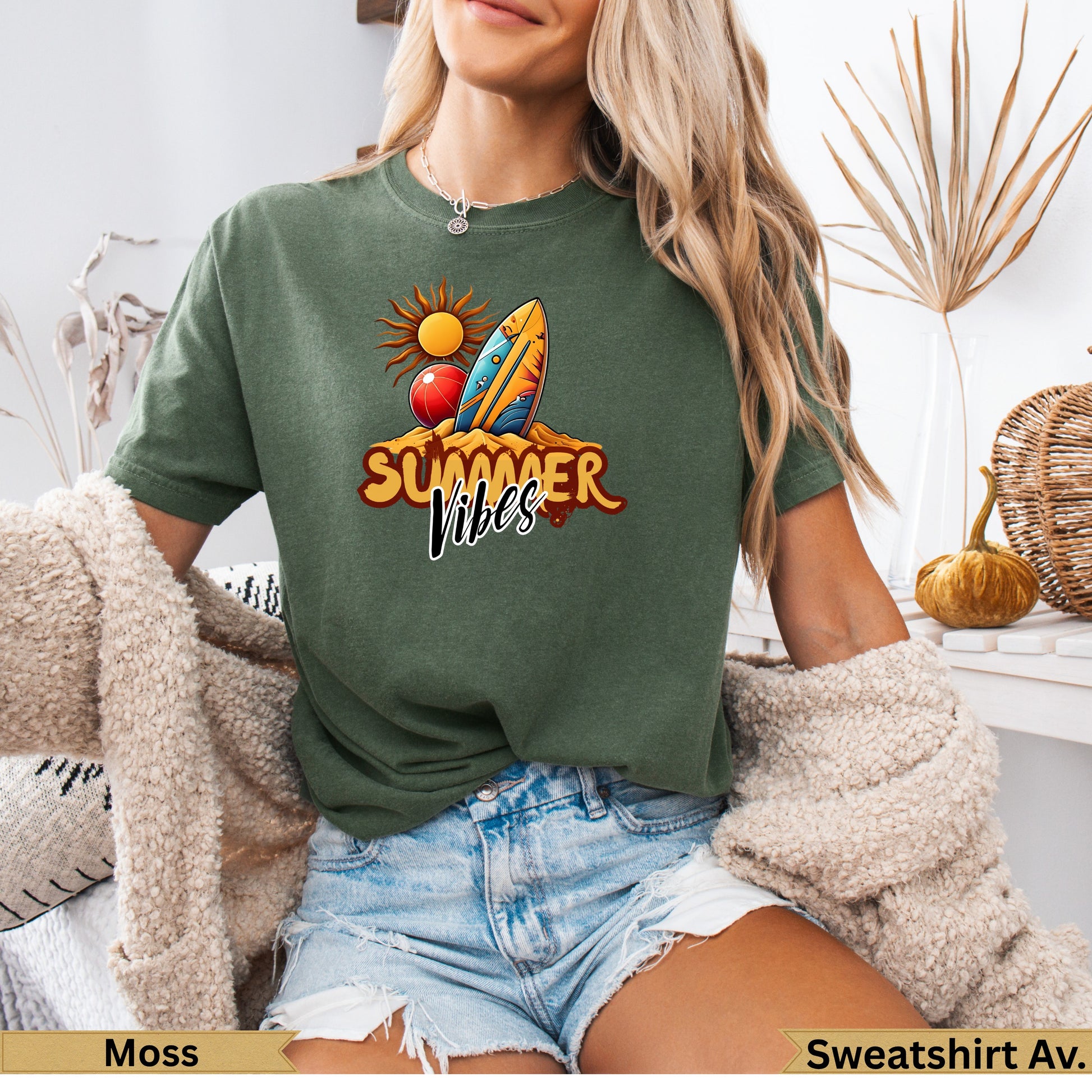Green t-shirt with "Summer Vibes" text, surfboard, and sun graphic.