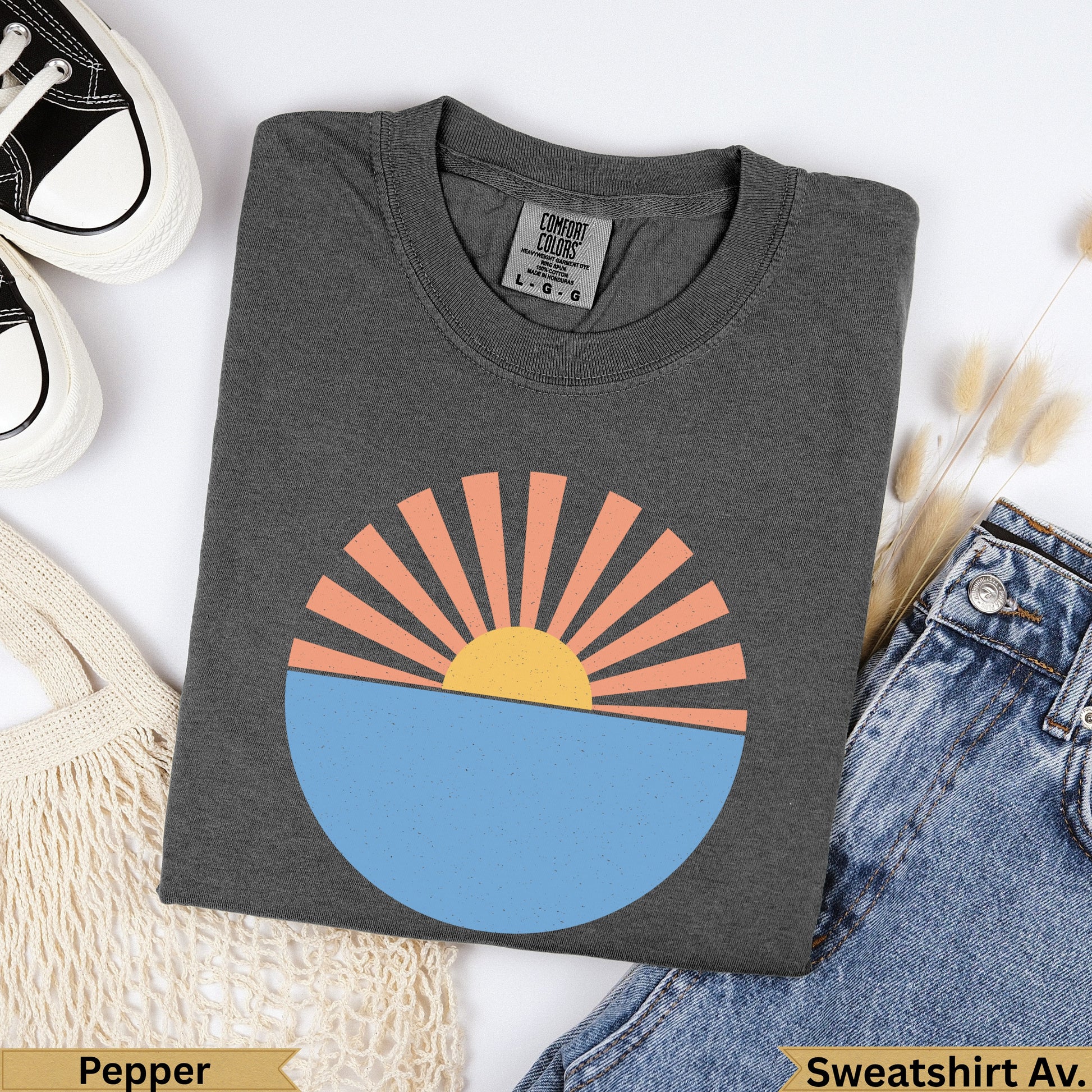 Dark grey t-shirt with rising sun graphic and "Pepper" text.