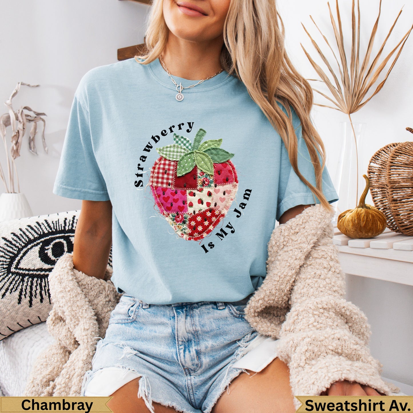 Light blue t-shirt with a strawberry quilt design and text.