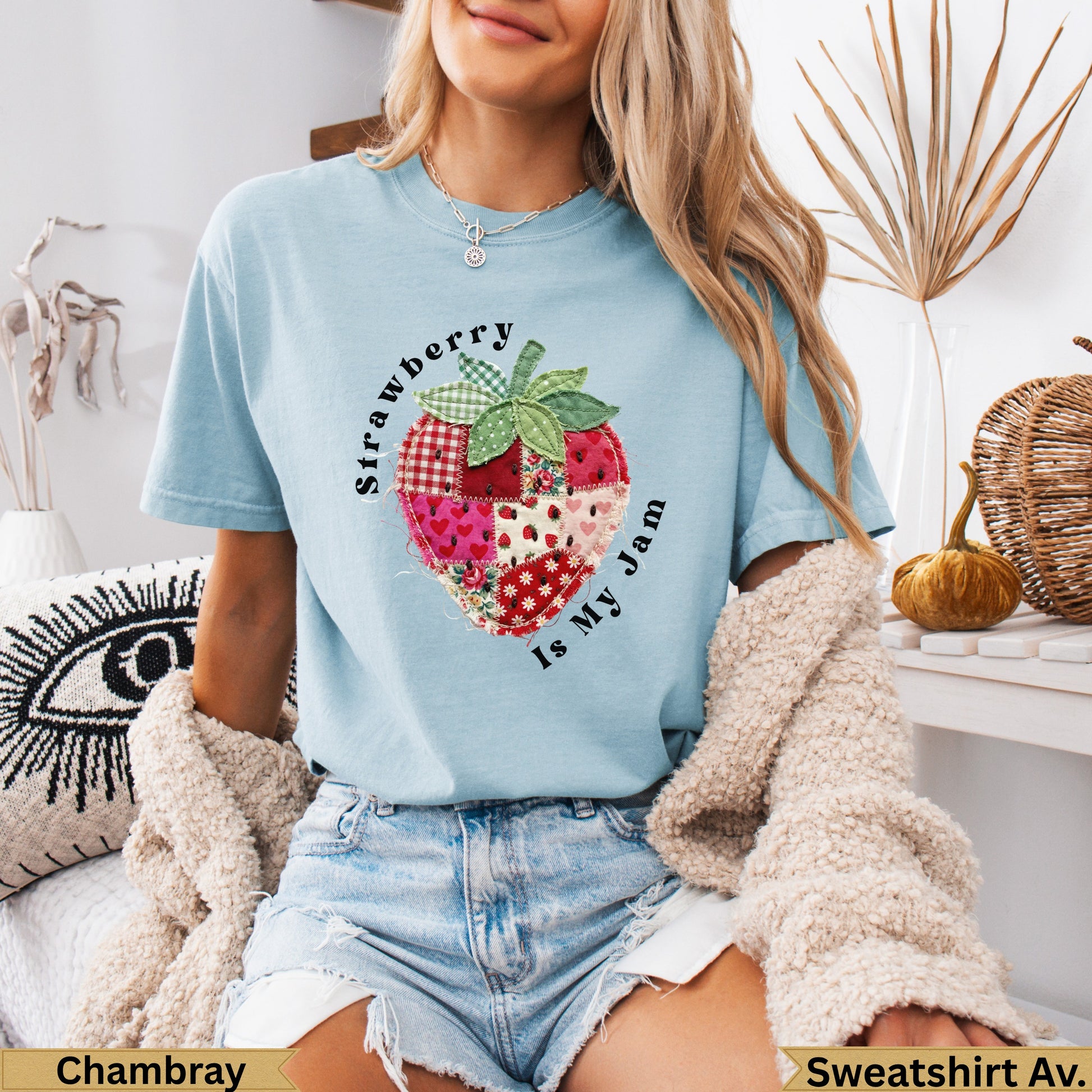 Light blue t-shirt with a strawberry quilt design and text.