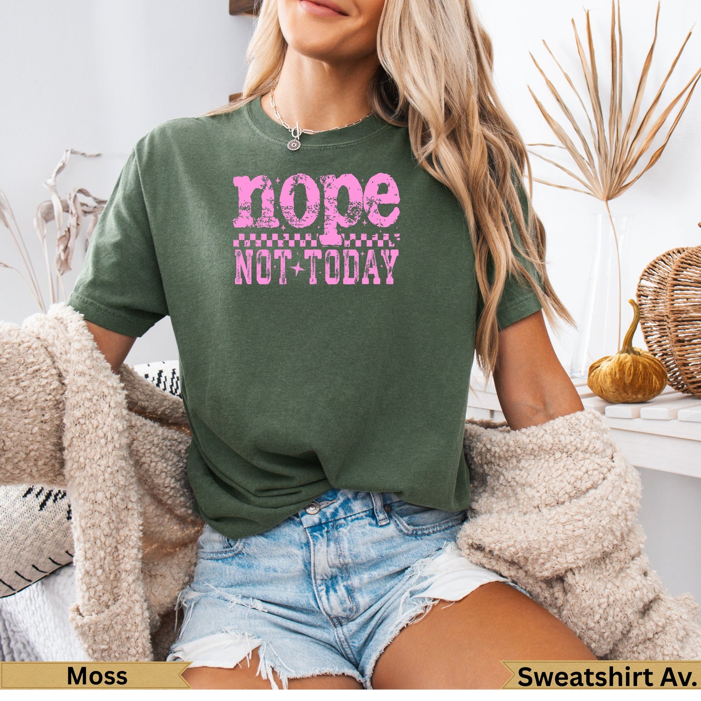 Green t-shirt with pink "nope not today" graphic and checkered pattern.