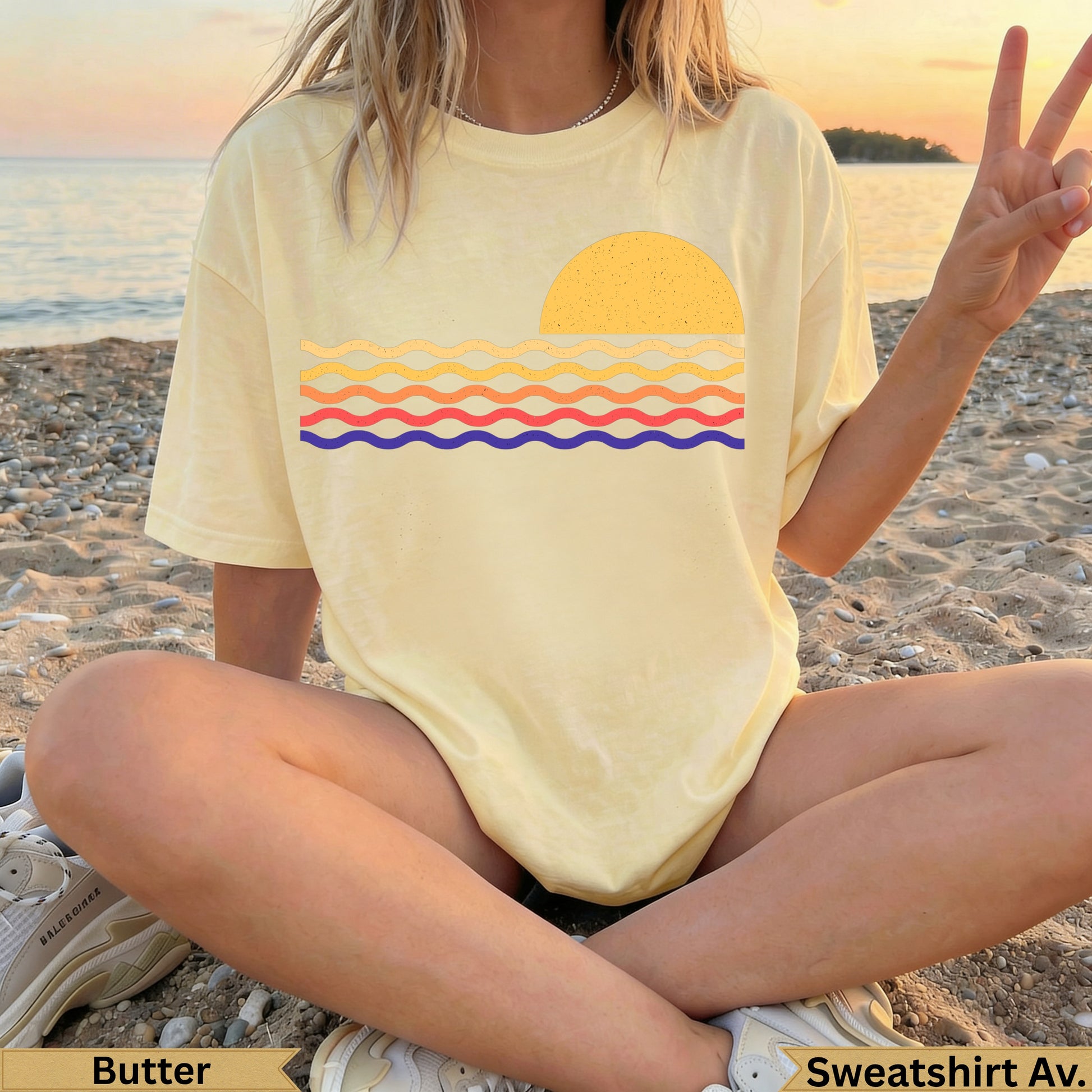 Yellow t-shirt with a stylized sun and wavy ocean design.