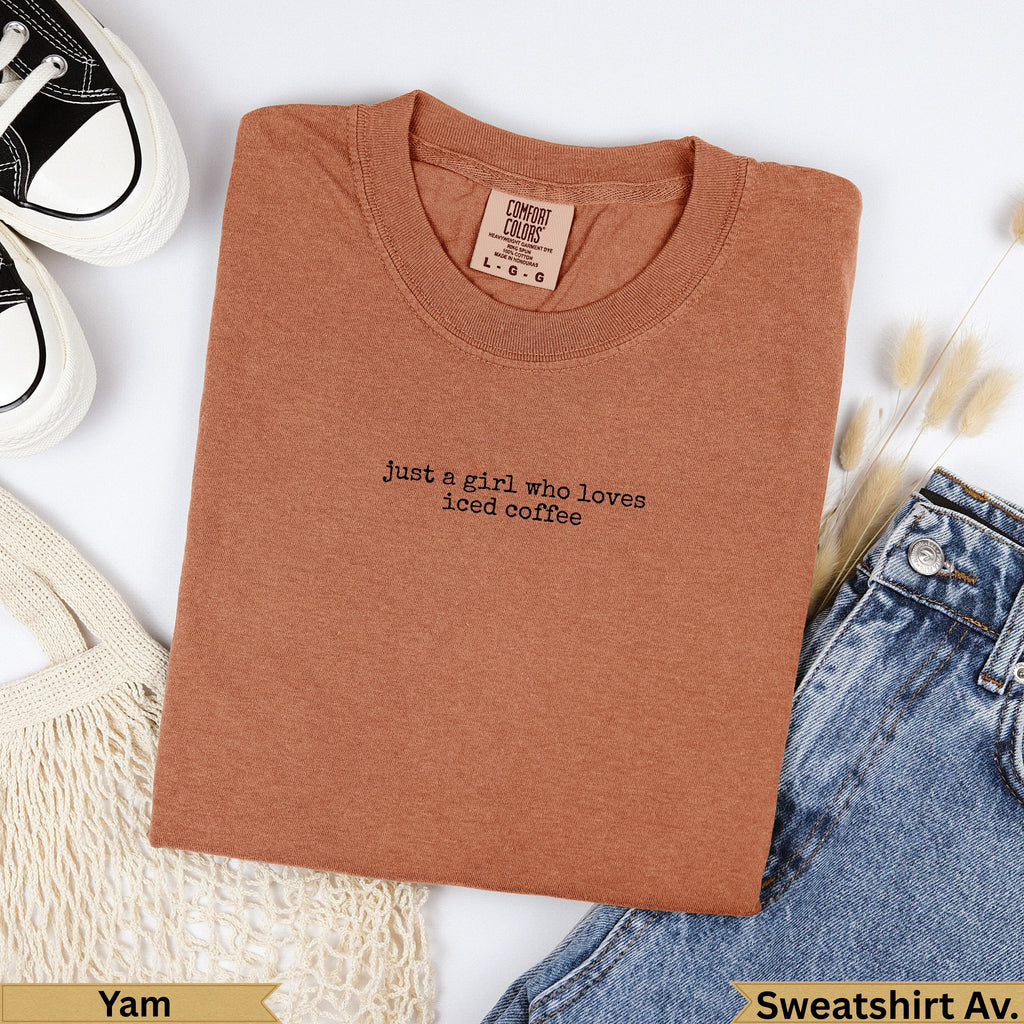 Brown "just a girl who loves iced coffee" graphic t-shirt.