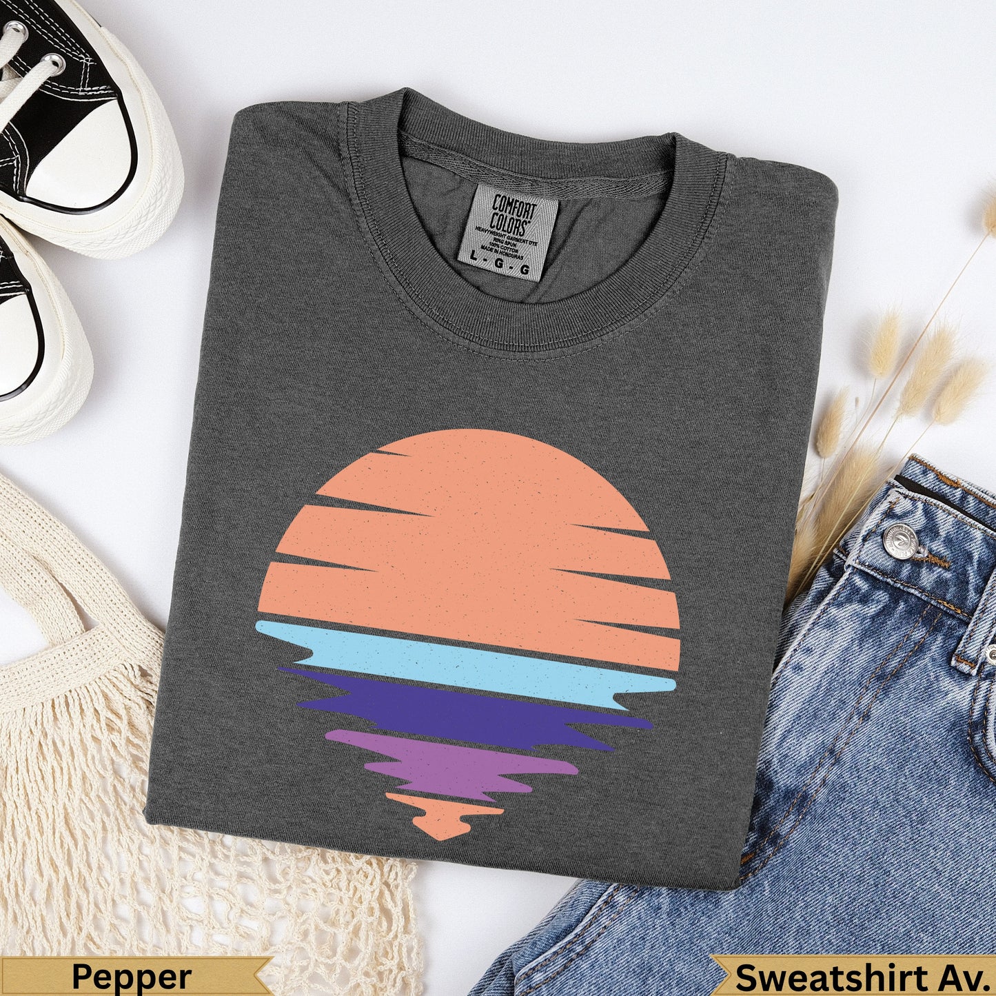 Dark gray Comfort Colors t-shirt with abstract sun and water graphic.