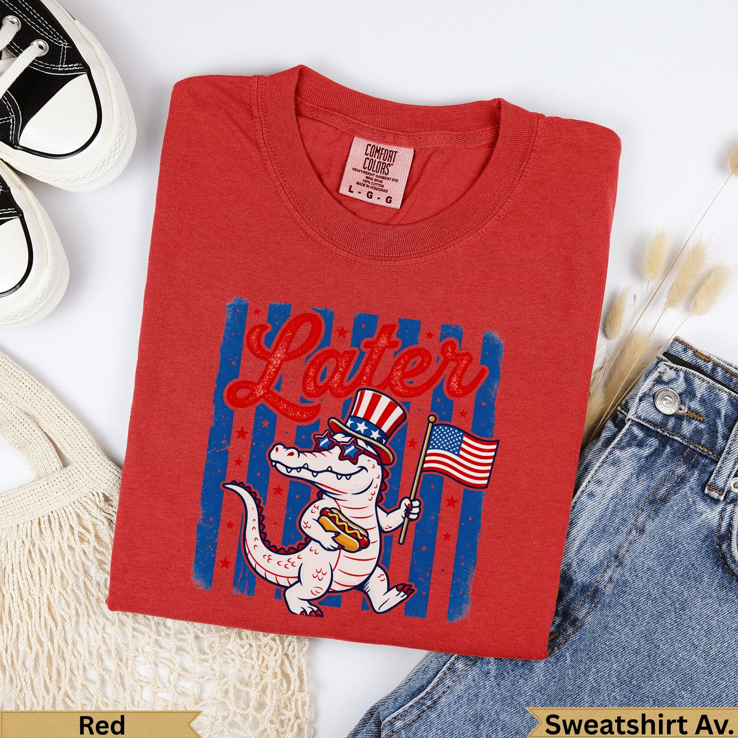 Red crew neck t-shirt with cartoon alligator, hot dog, and American flag.