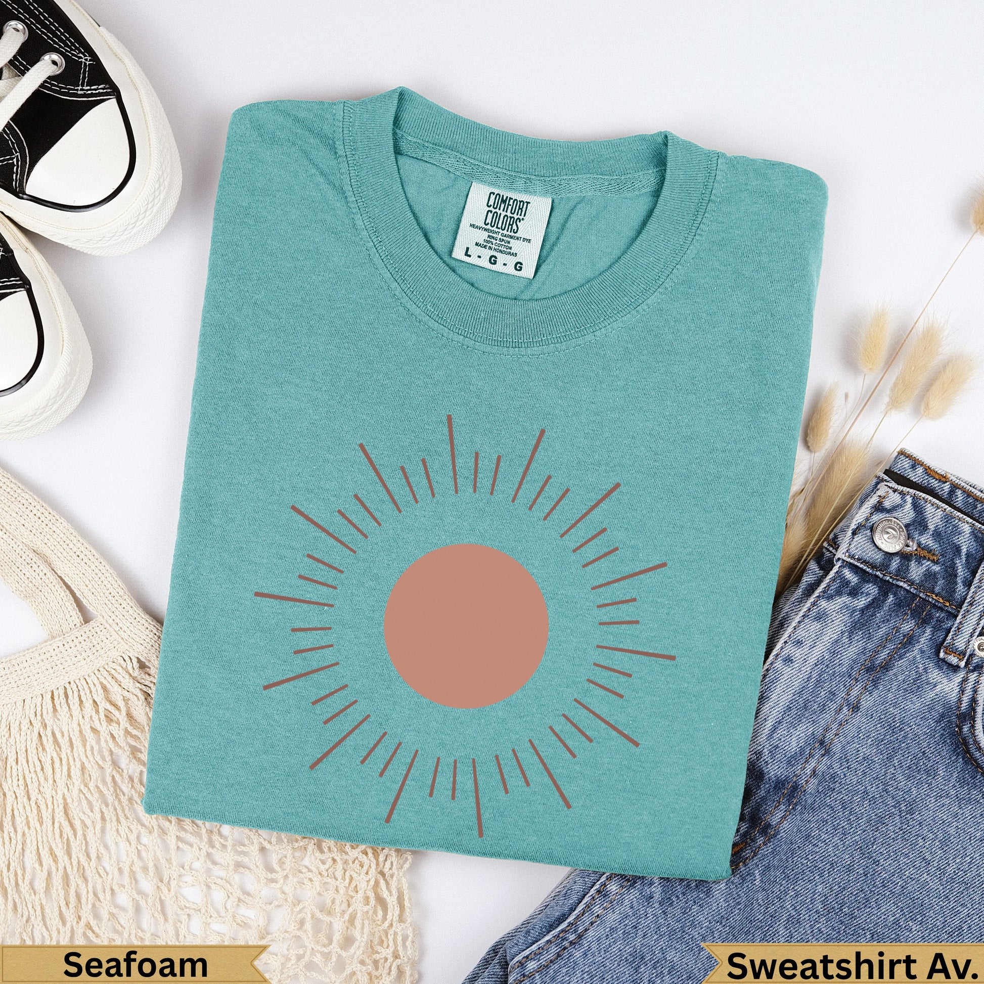 Seafoam Comfort Colors sweatshirt with a burnt orange sun graphic and "Seafoam" text.