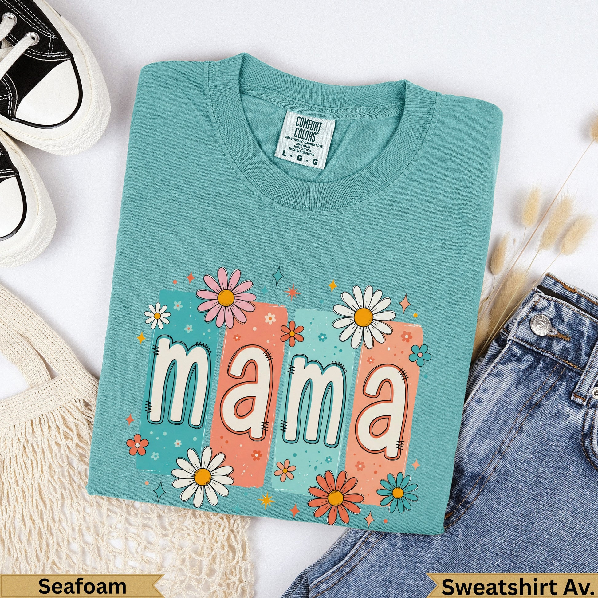 Teal mama sweatshirt with floral accents and size tag.