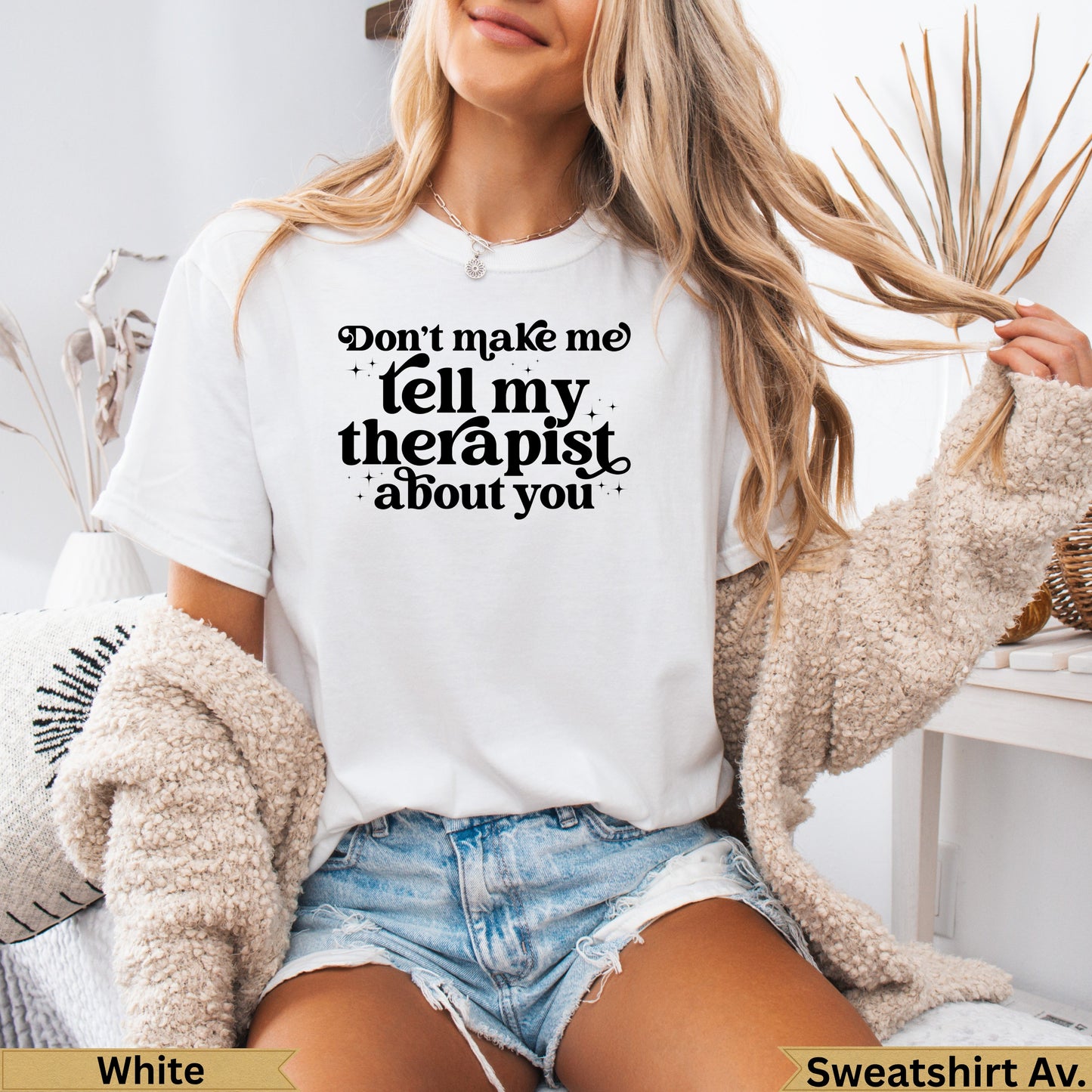 White t-shirt with "Don't make me tell you about you" graphic.
