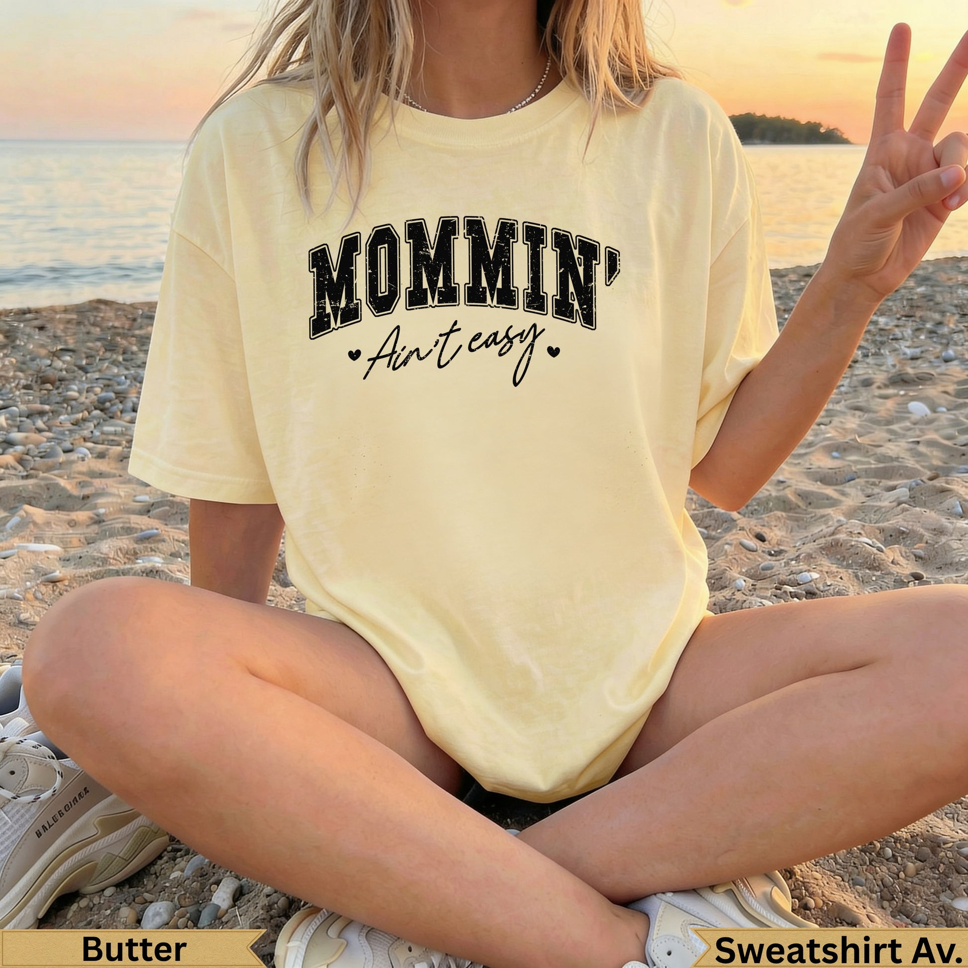 Yellow "Mommin' Ain't Easy" t-shirt with peace sign.