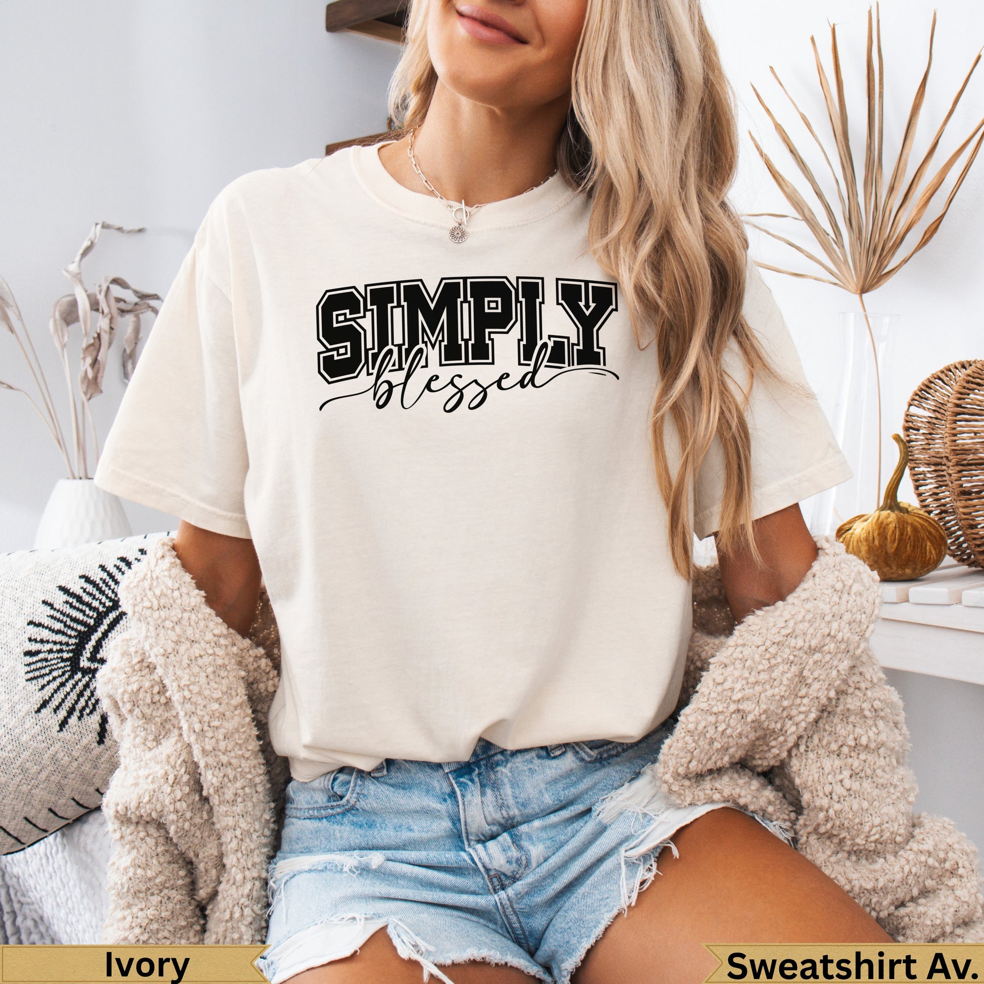 Cream t-shirt with "SIMPLY blessed" text in black and white lettering.