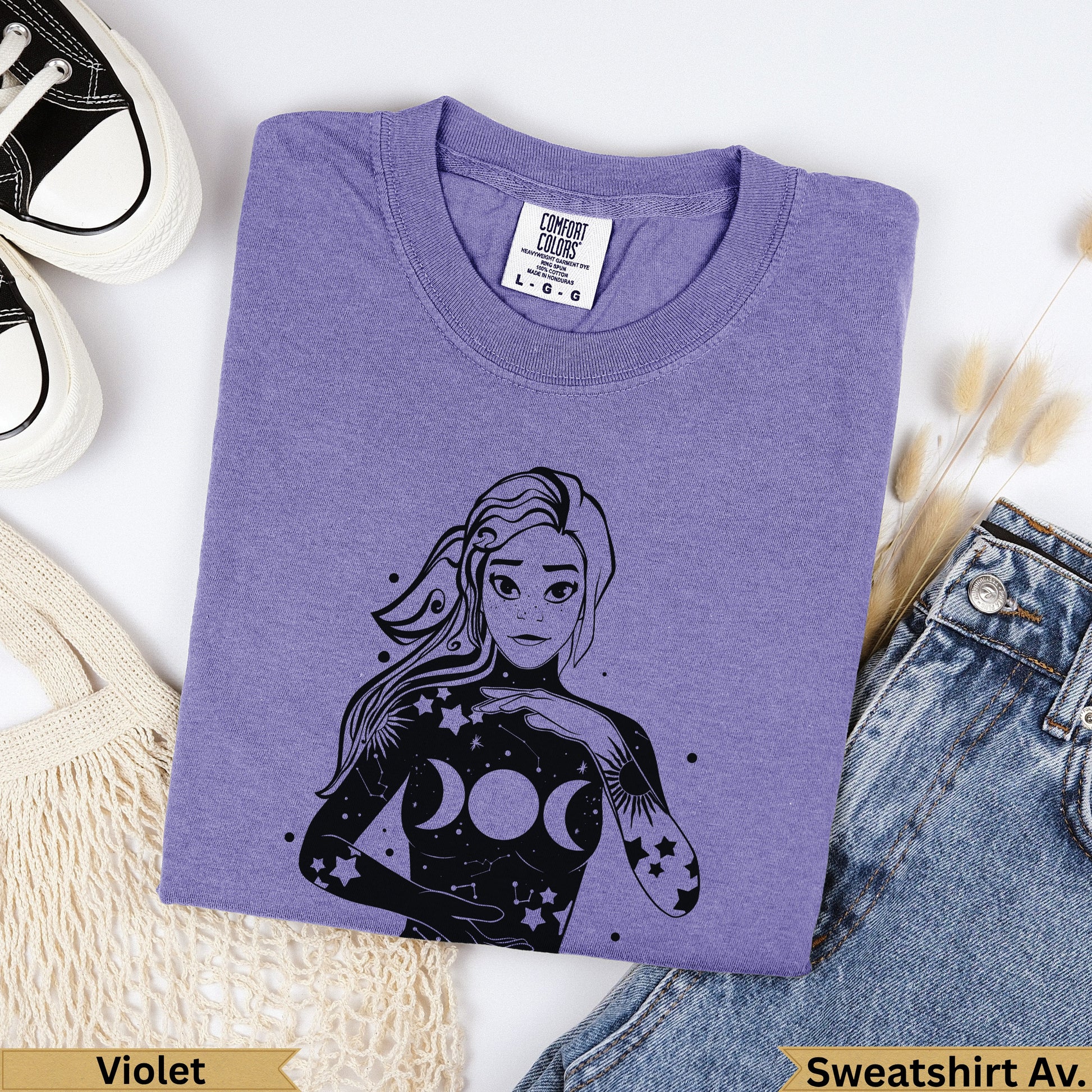 Purple Comfort Colors sweatshirt with celestial moon goddess graphic.