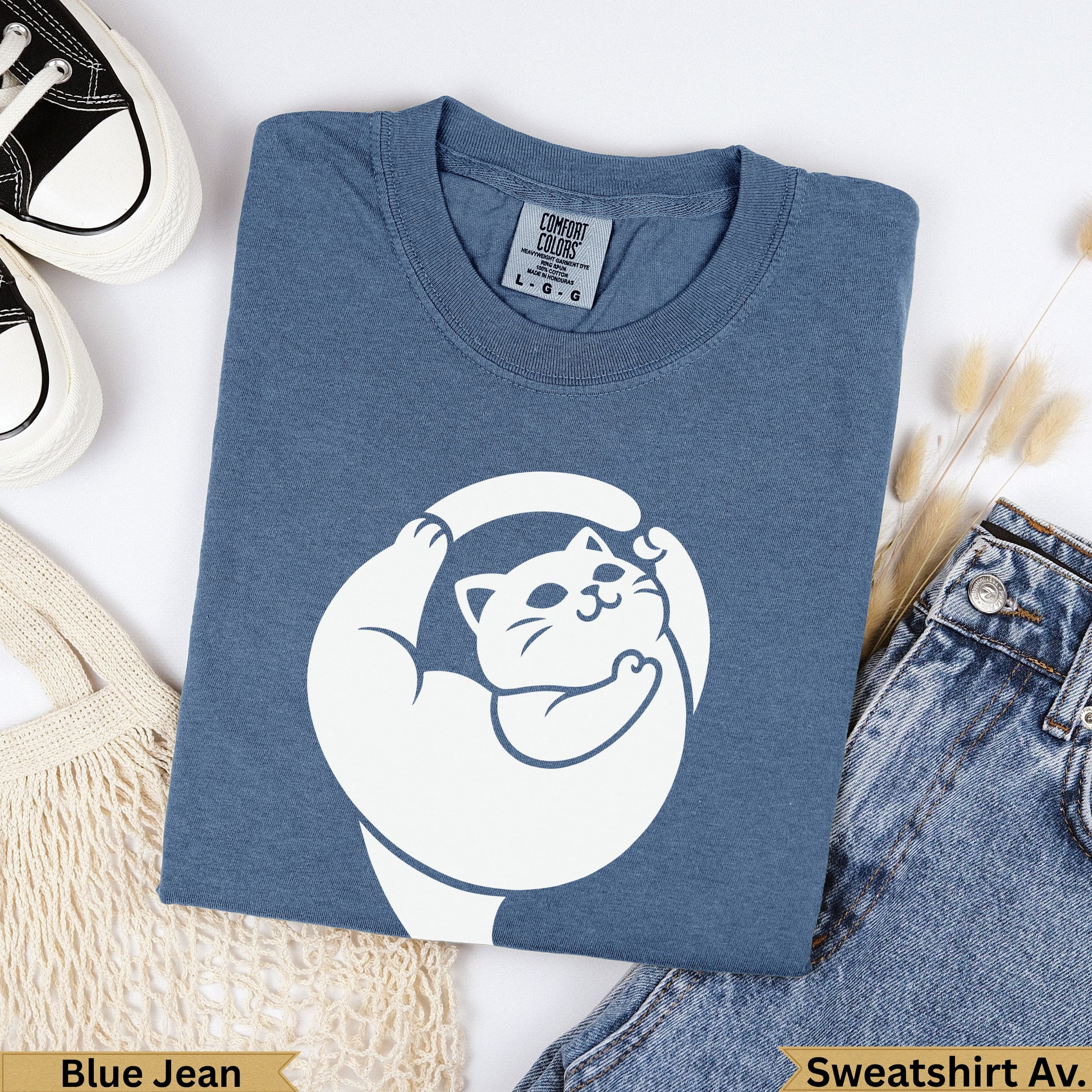 Blue Jean Comfort Colors sweatshirt with white cat graphic and "Sweatshirt Av." text.