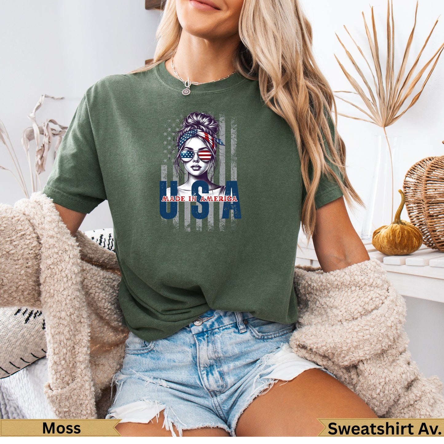 Woman wearing green t-shirt with "Made in America" USA flag graphic.