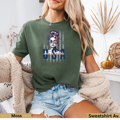 Woman wearing green t-shirt with "Made in America" USA flag graphic.