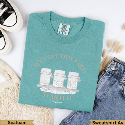 Teal t-shirt with "Let's Get This Party Started" and three jars graphic.