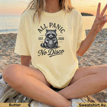 Yellow "All Panic No Disco" t-shirt with raccoon and disco ball graphic.