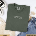 Olive green t-shirt with "apparently, I work for my cat" text.