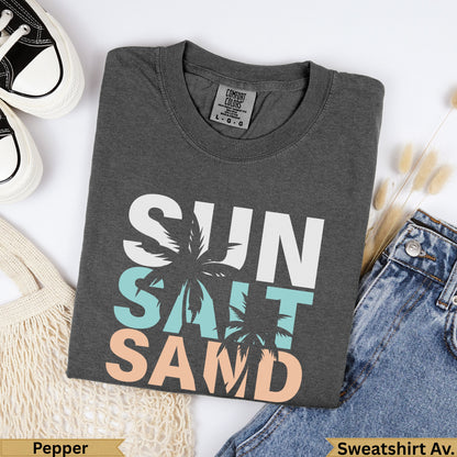 Dark grey t-shirt with "SUN SALT SAND" text, palm trees, and tags.