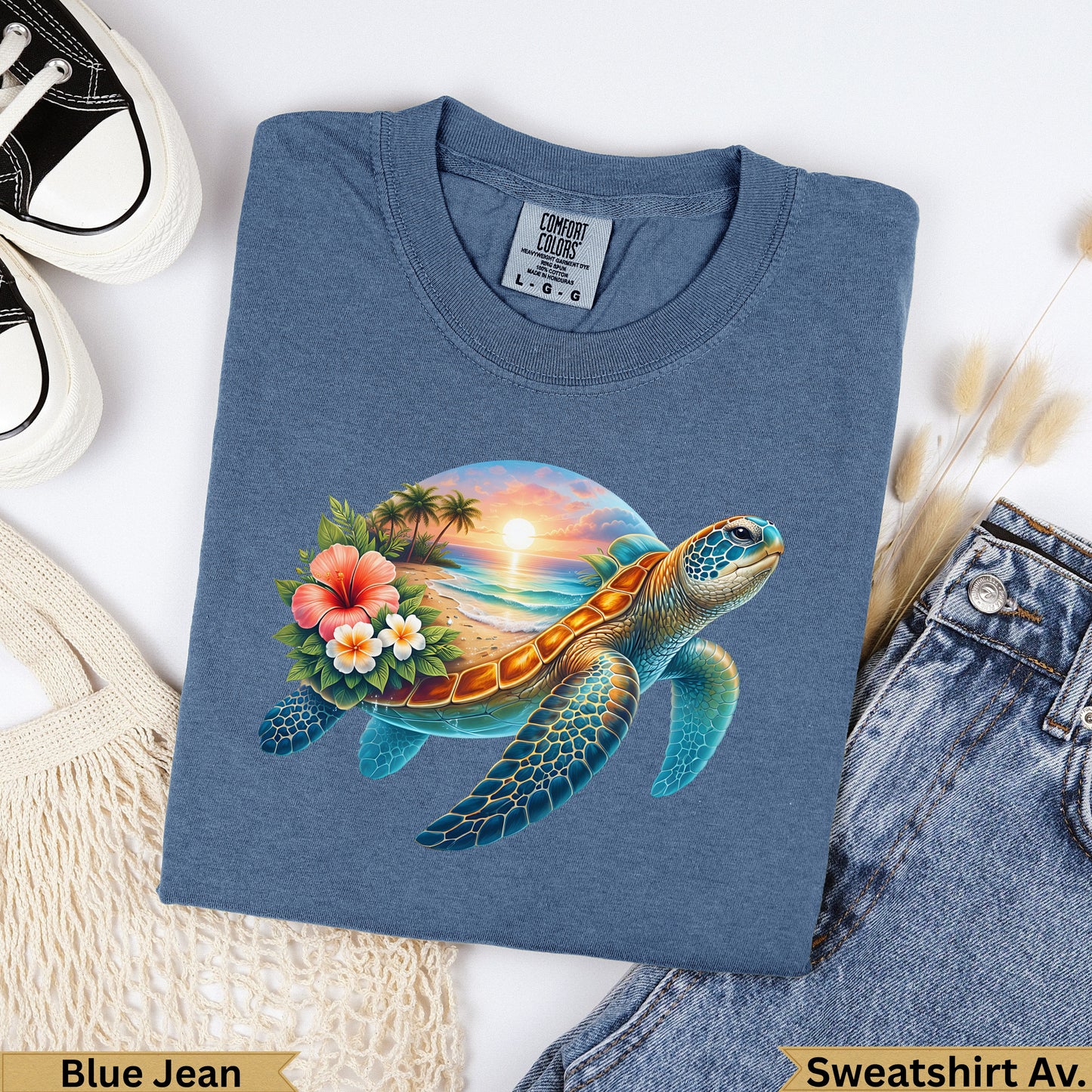 Blue t-shirt with a sunset beach scene and sea turtle graphic.