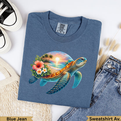 Blue t-shirt with a sunset beach scene and sea turtle graphic.