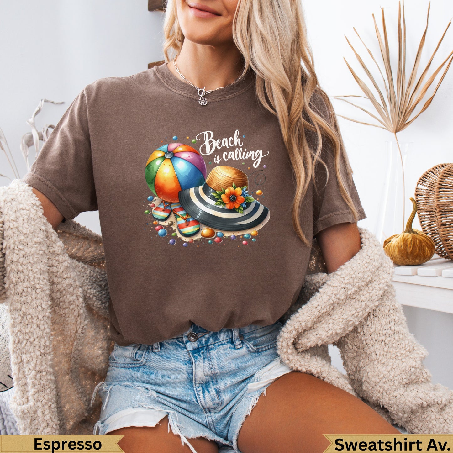 T-shirt with beach ball, hat, and "Beach is calling" text.