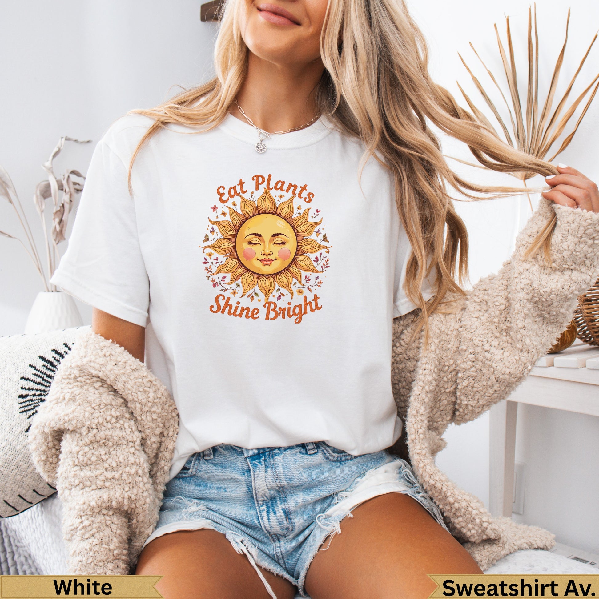 White t-shirt with "Eat Plants Shine Bright" text and a sun graphic.