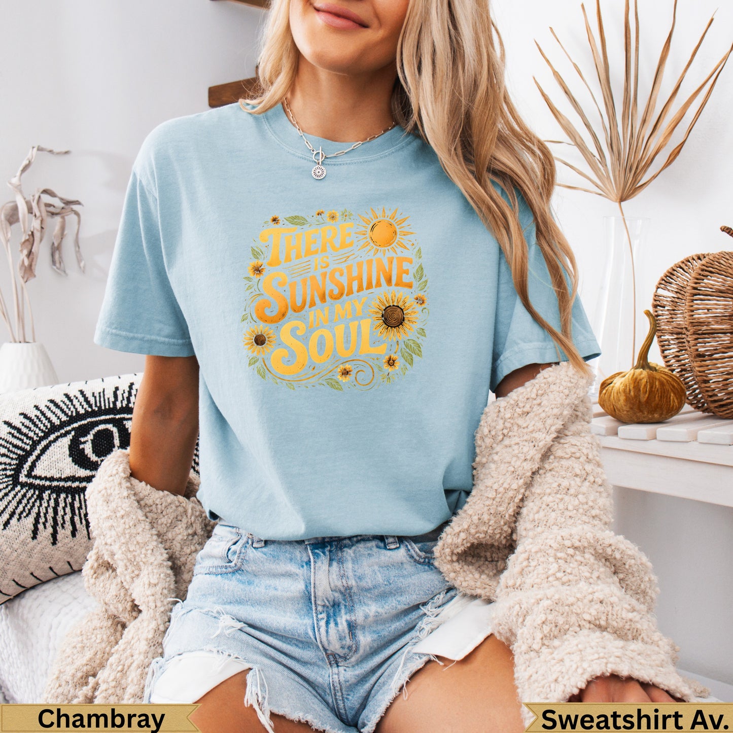 Light blue t-shirt with "There is sunshine in my soul" text and sun graphics.