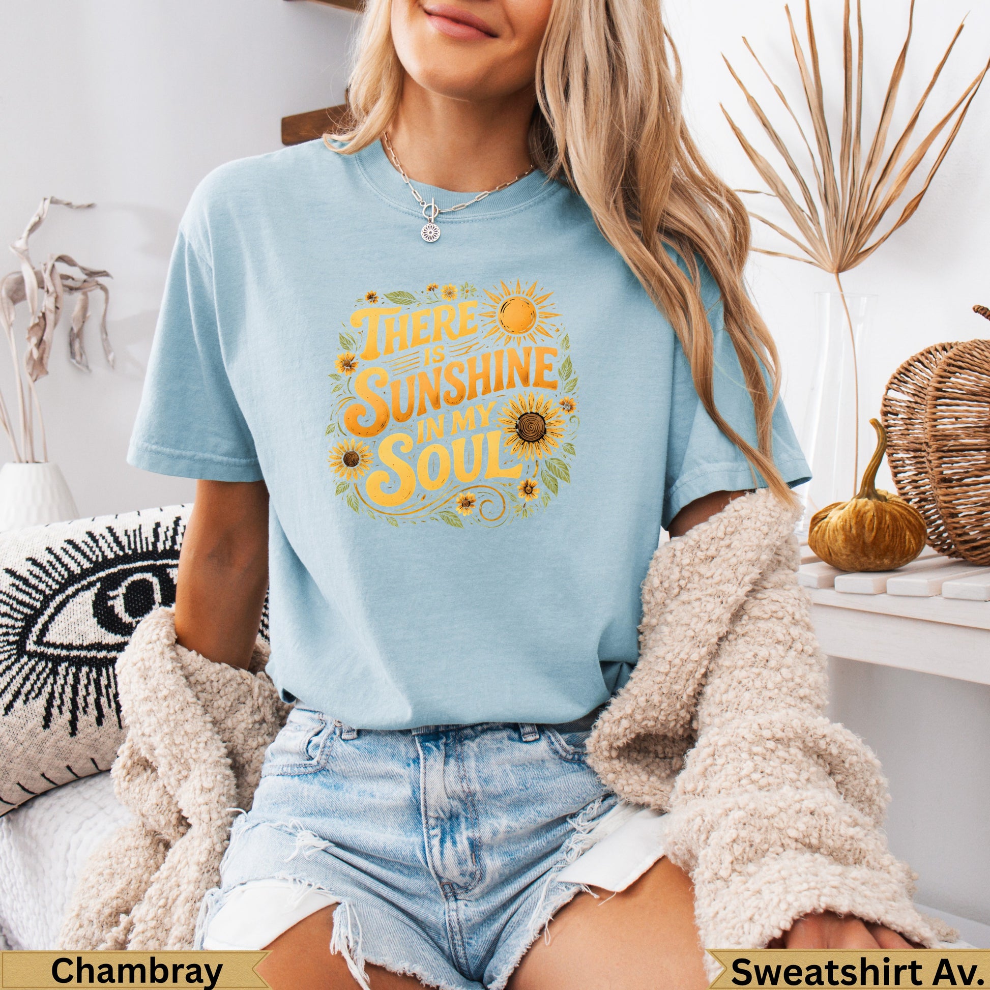 Light blue t-shirt with "There is sunshine in my soul" text and sun graphics.