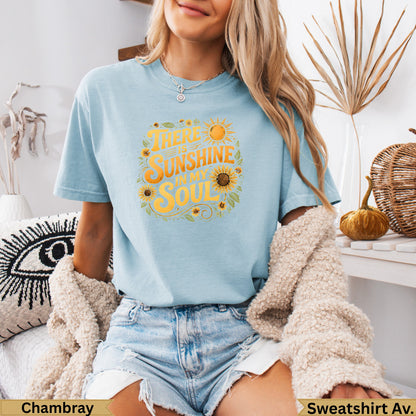 Light blue t-shirt with "There is sunshine in my soul" text and sun graphics.