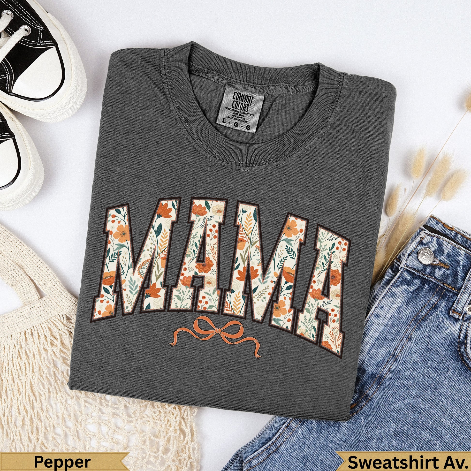 Dark gray sweatshirt with "MAMA" in floral pattern and a bow.