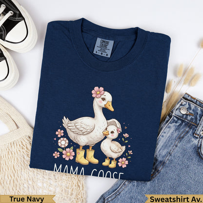 Navy blue sweatshirt with mama and baby geese illustration and "MAMA GOOSE" text.
