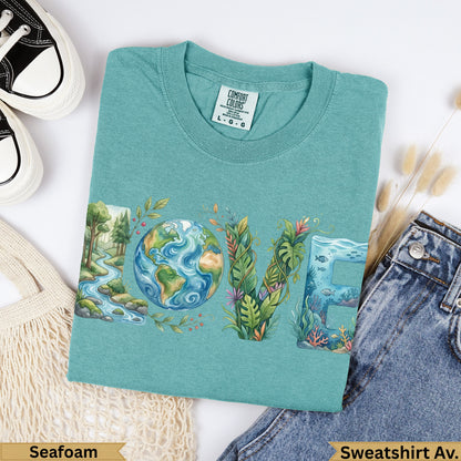 Green t-shirt with "LOVE" text incorporating Earth, plants, and ocean life.