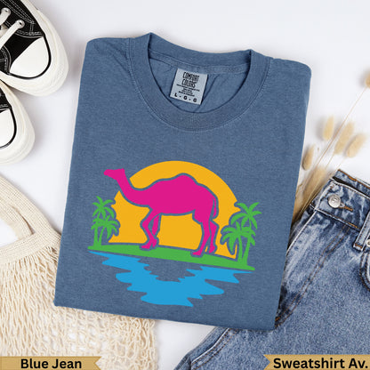 Blue crewneck sweatshirt with a neon pink camel graphic, palm trees, and yellow sun.