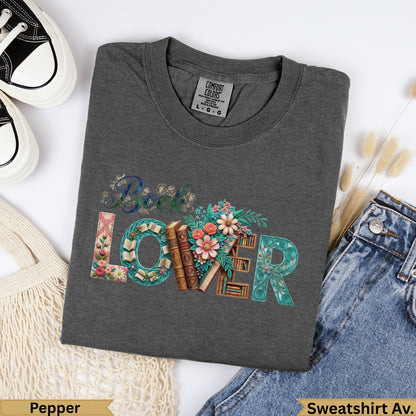 Dark gray t-shirt with "BOOK LOVER" text design and floral accents.