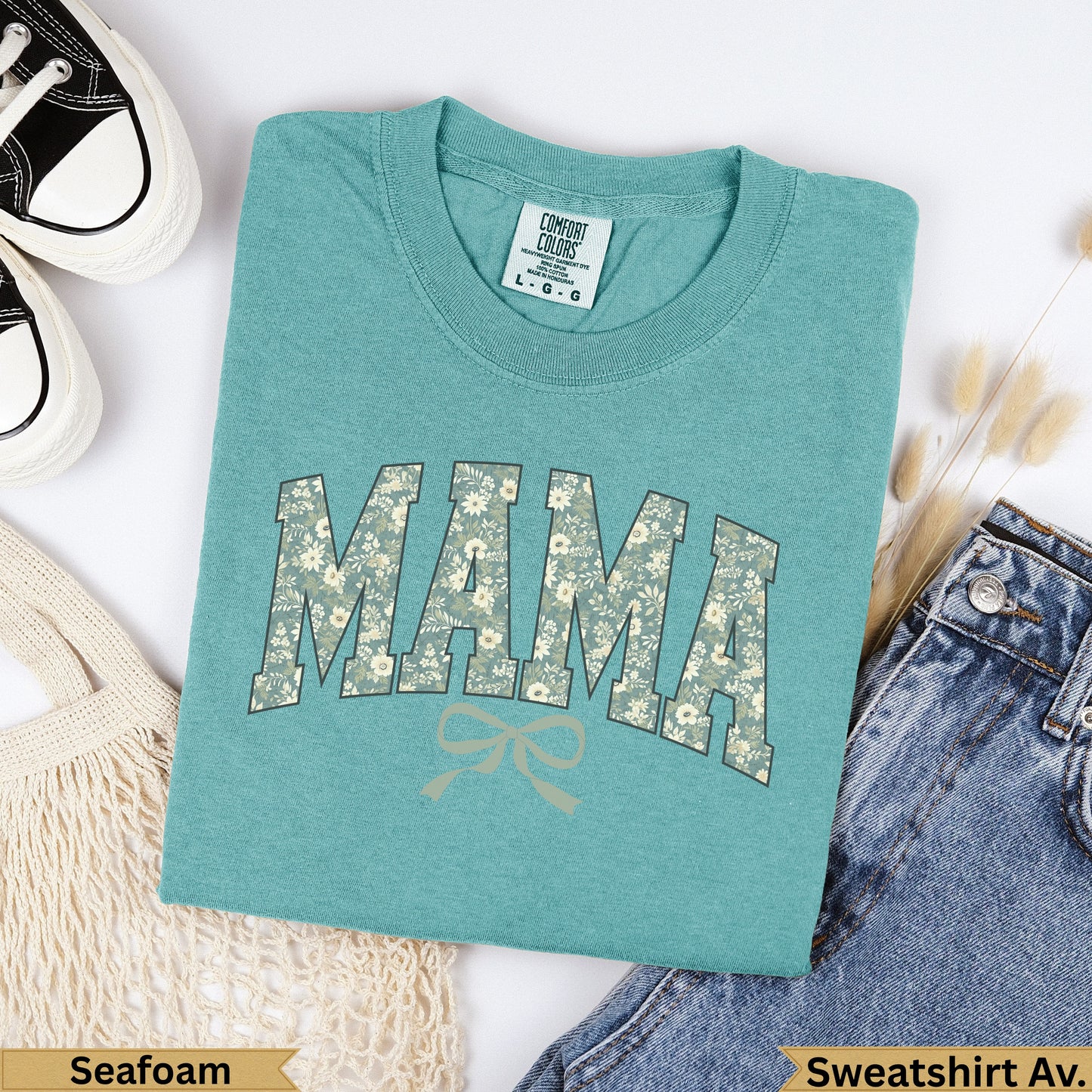 Teal Comfort Colors sweatshirt with "MAMA" in floral print and a bow.