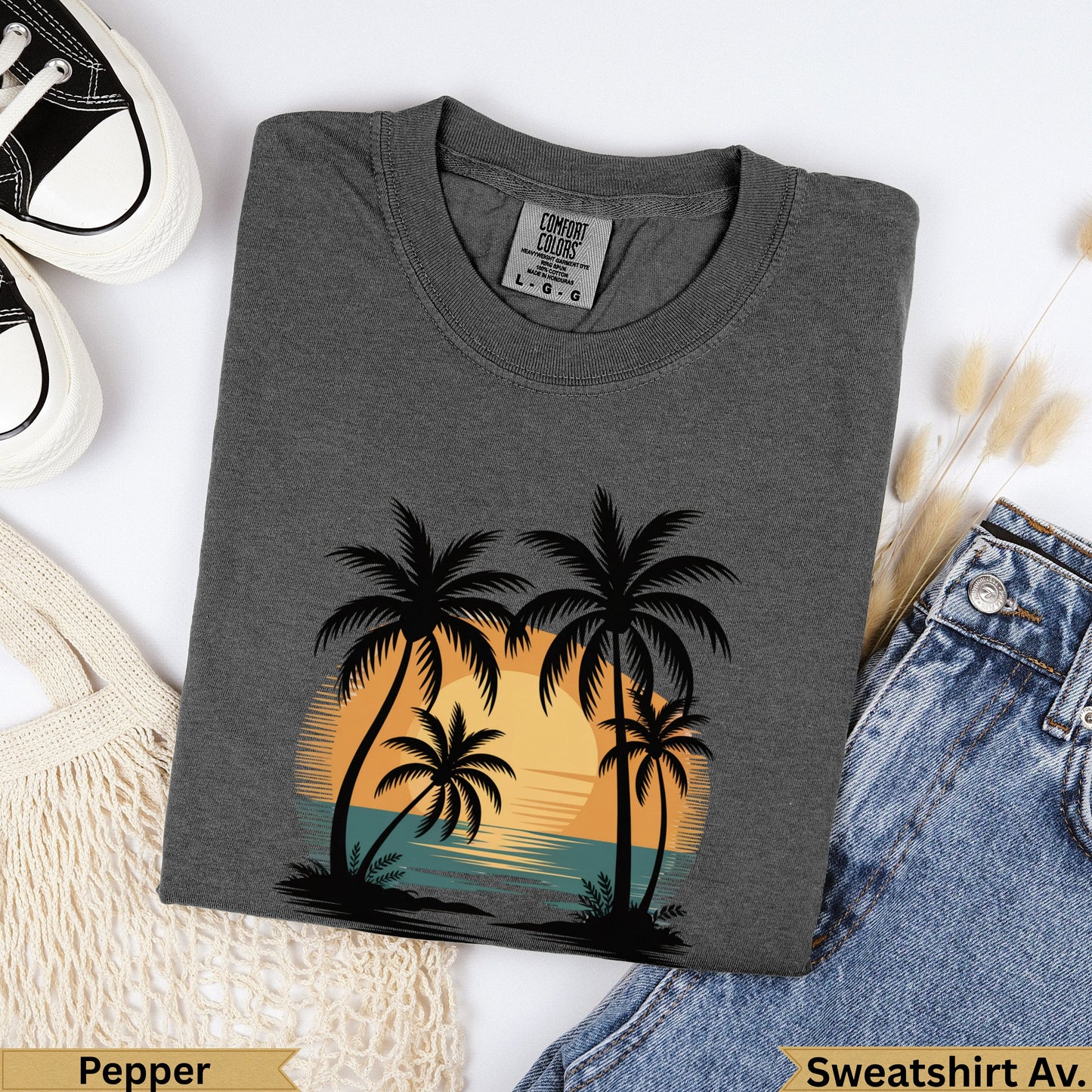 Dark grey crewneck t-shirt with sunset palm tree graphic and "Pepper" text.