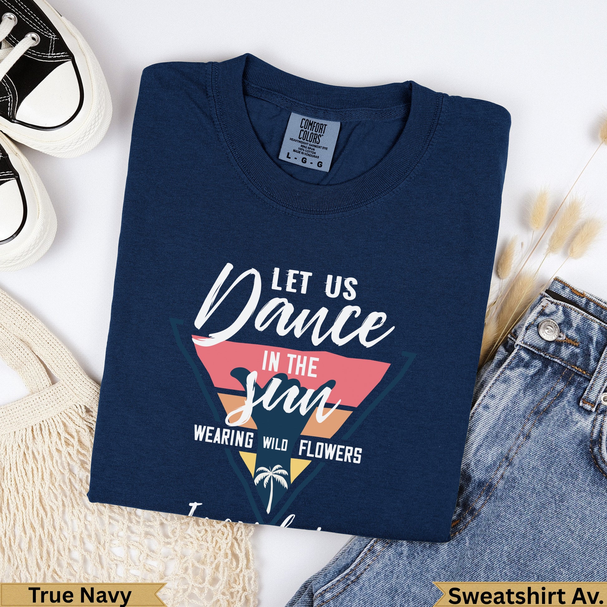 Navy sweatshirt with "Dance in the Sun Wearing Wild Flowers" graphic.