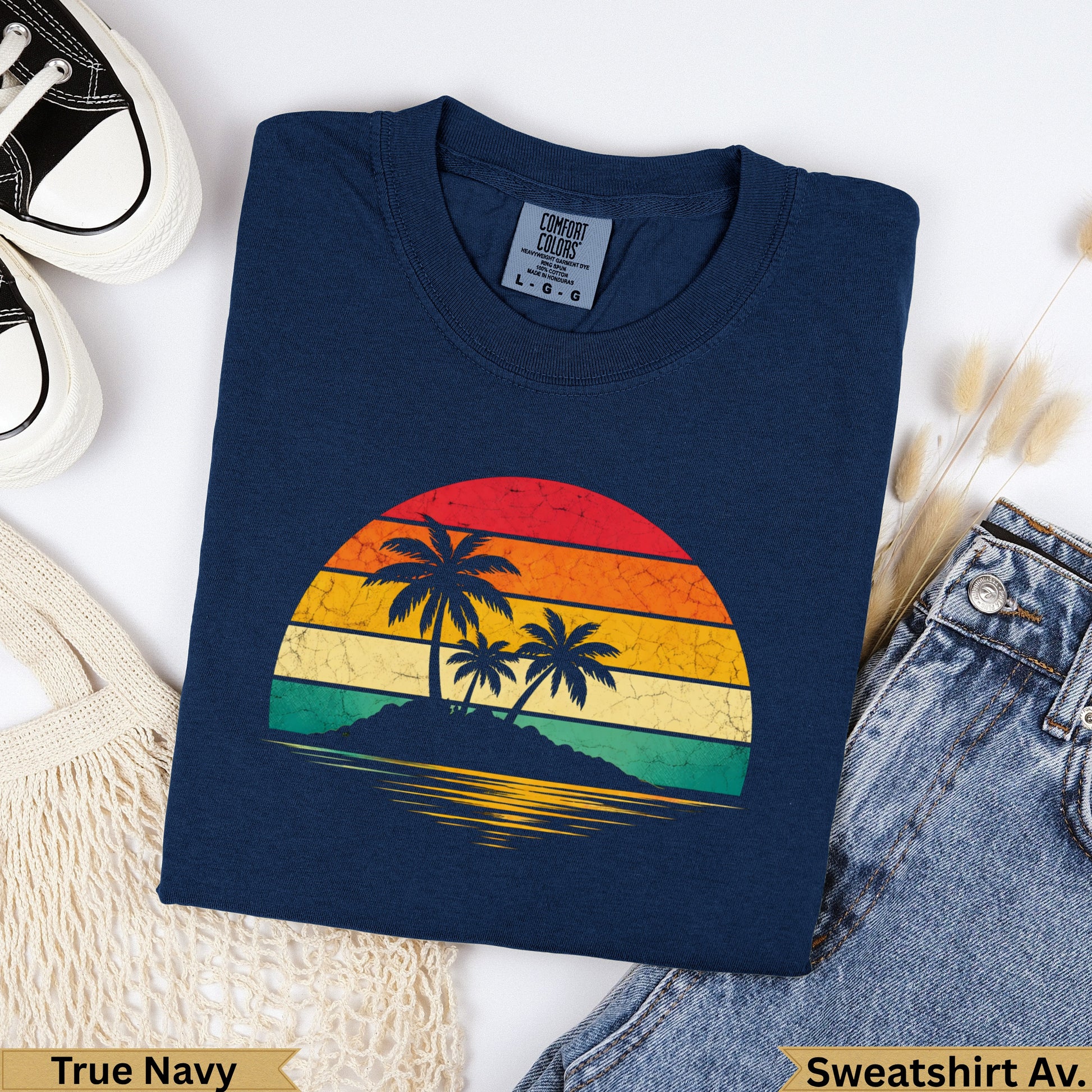 Navy blue crewneck sweatshirt with vintage sunset and palm tree graphic.
