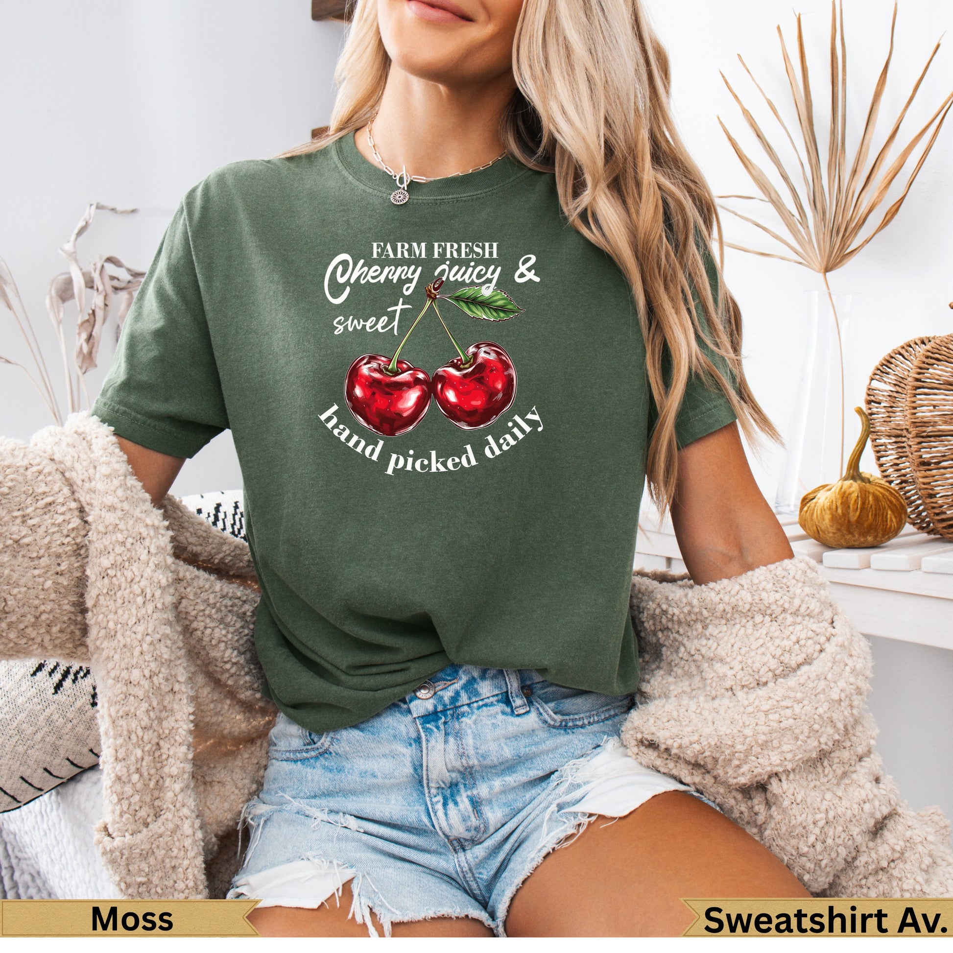 Green t-shirt with "Farm Fresh Cherry Juicy & hand picked daily" and two cherries.