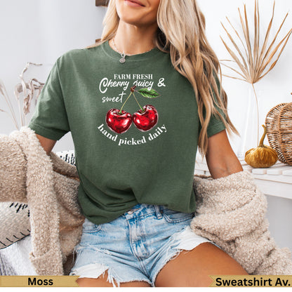 Green t-shirt with "Farm Fresh Cherry Juicy & hand picked daily" and two cherries.