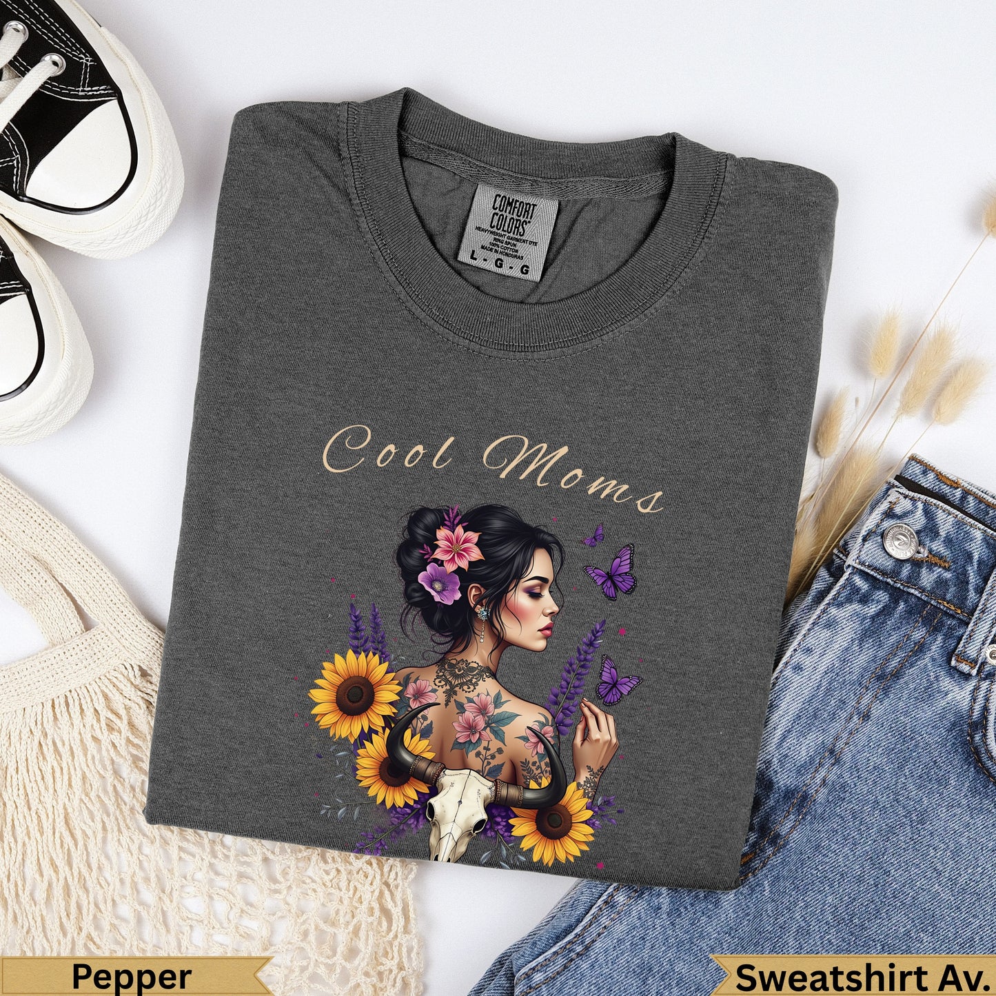 Dark grey t-shirt with "Cool Moms" text and a tattooed woman with sunflowers and butterflies.