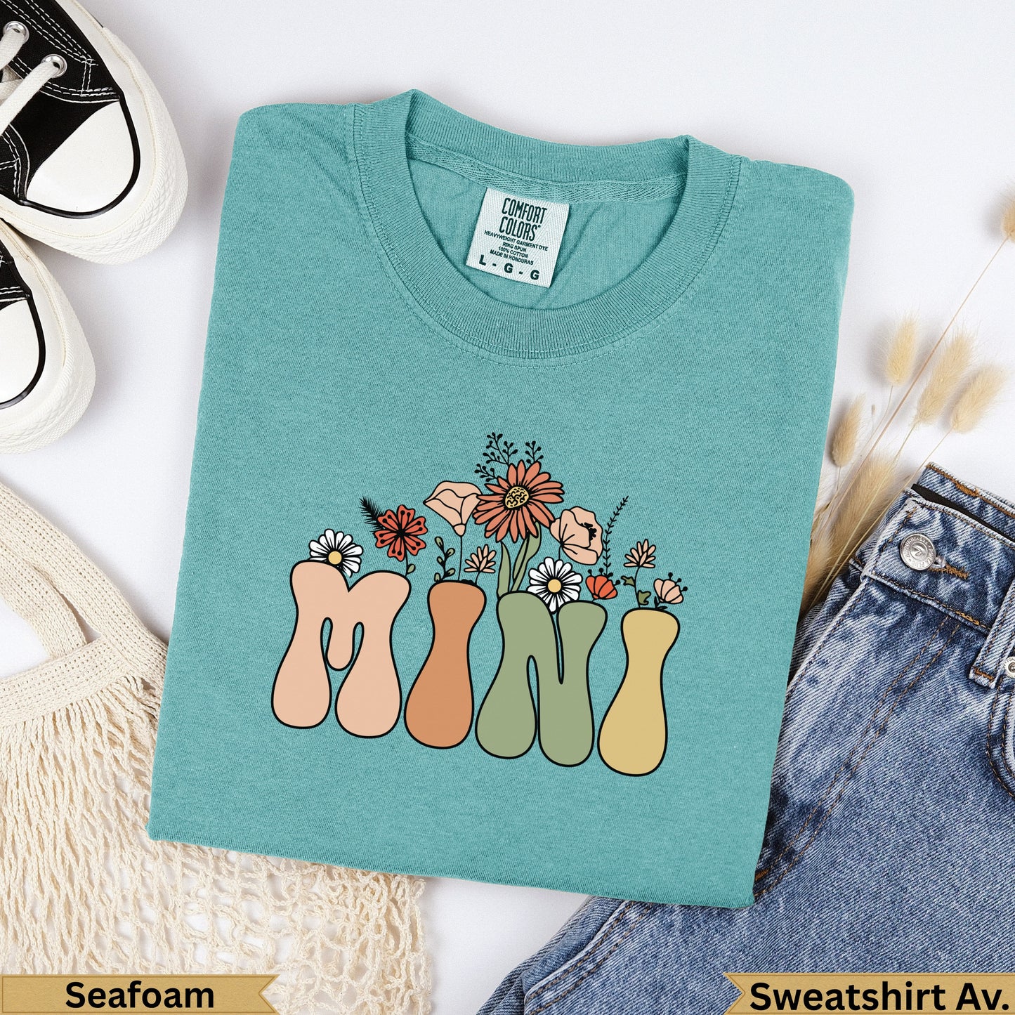 Teal Comfort Colors sweatshirt with "MINI" text and floral design.