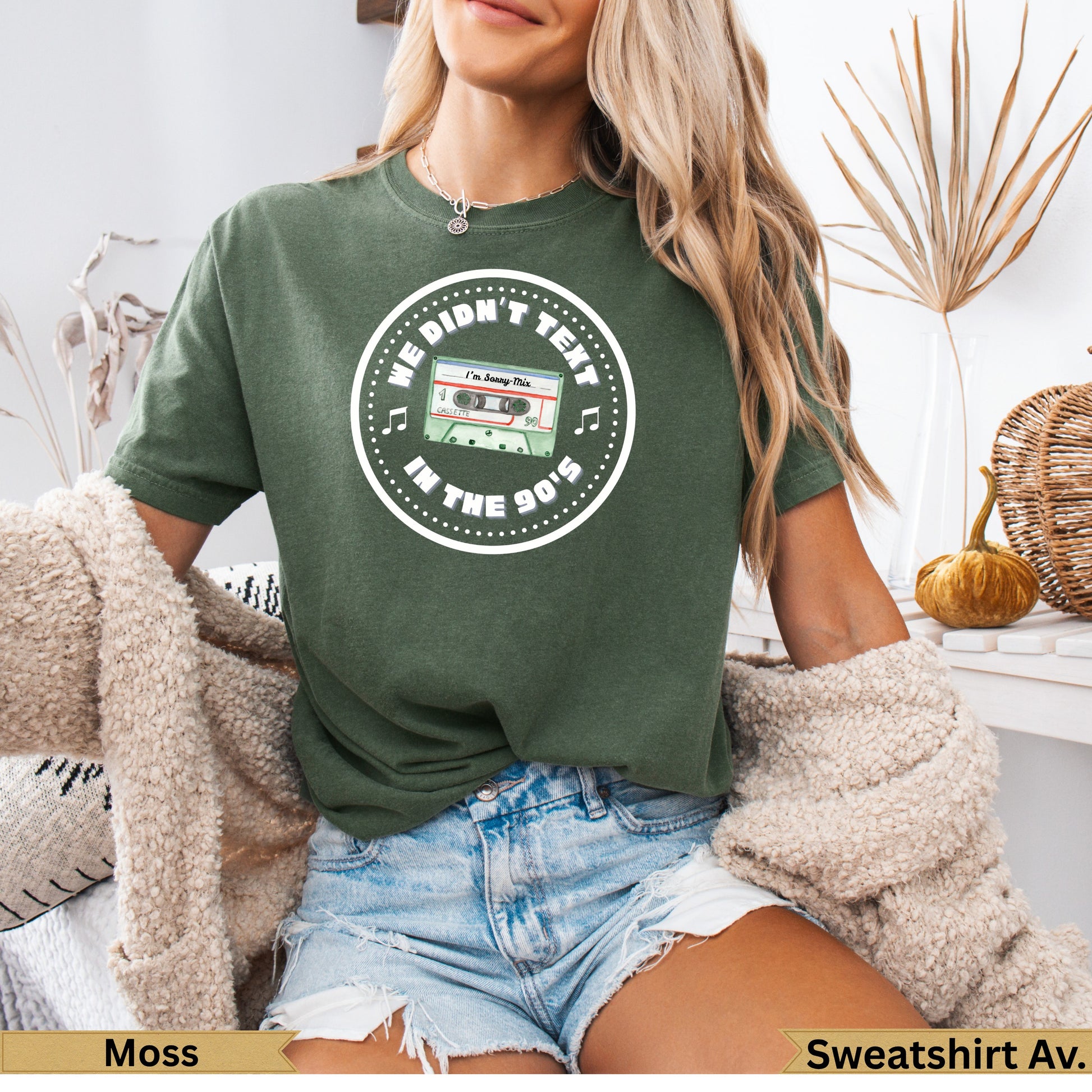 Green sweatshirt with "We Didn't Text in the 90's" cassette tape graphic.