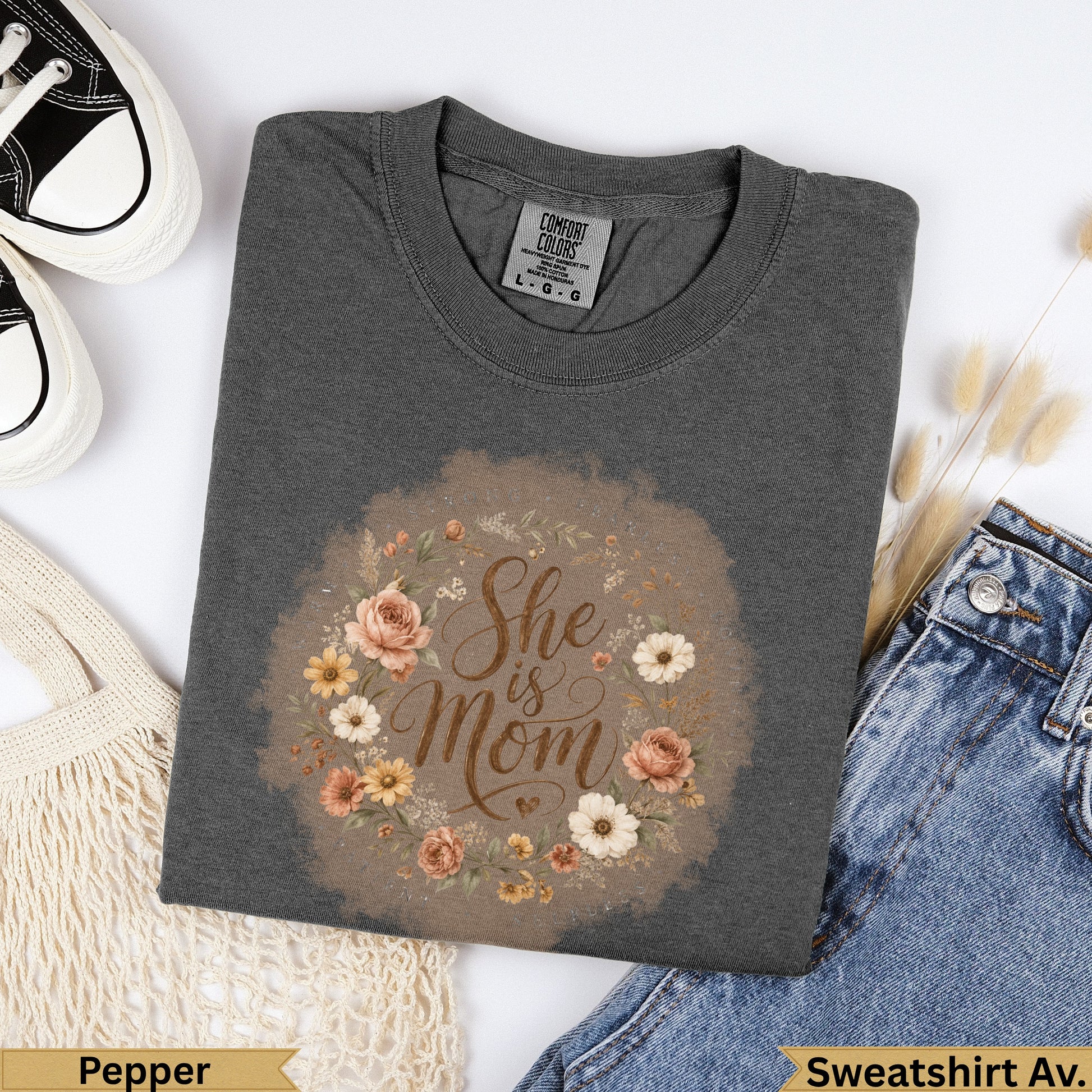 Dark grey sweatshirt with floral wreath and "She is Mom" text.