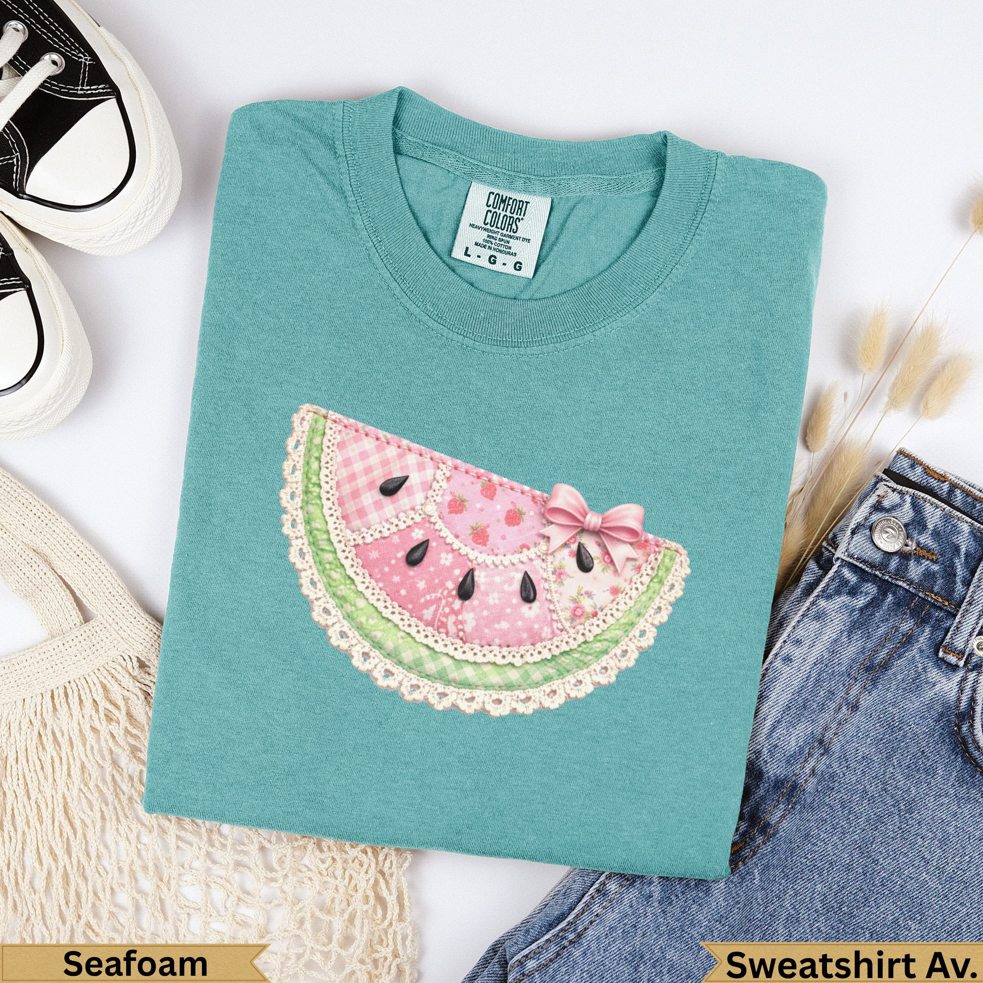 Teal sweatshirt with watermelon patch graphic and "Seafoam" text.