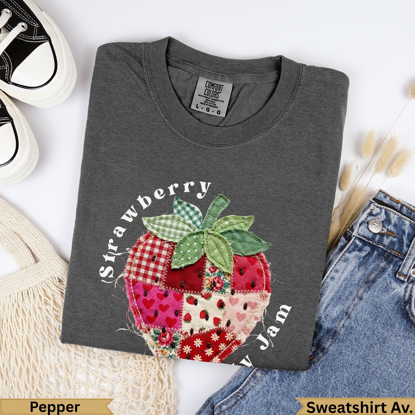 Charcoal t-shirt with a patchwork strawberry graphic and "Strawberry Jam" text.