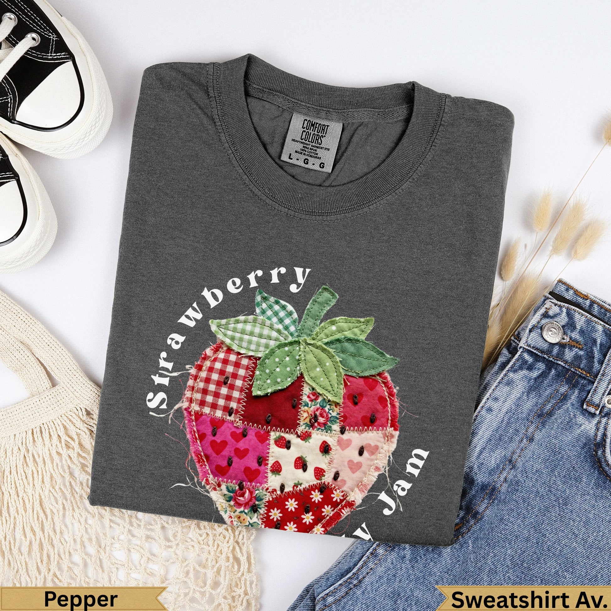 Charcoal t-shirt with a patchwork strawberry graphic and "Strawberry Jam" text.