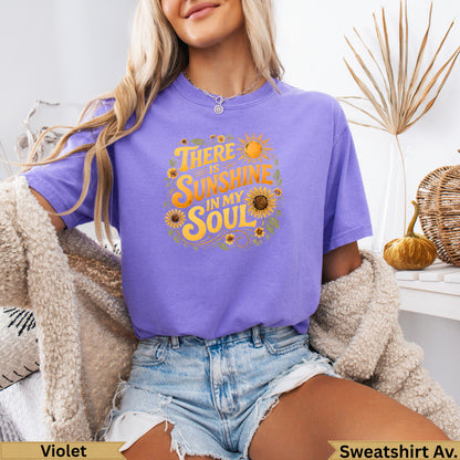 Purple t-shirt with "There is sunshine in my soul" text and sunflower design.