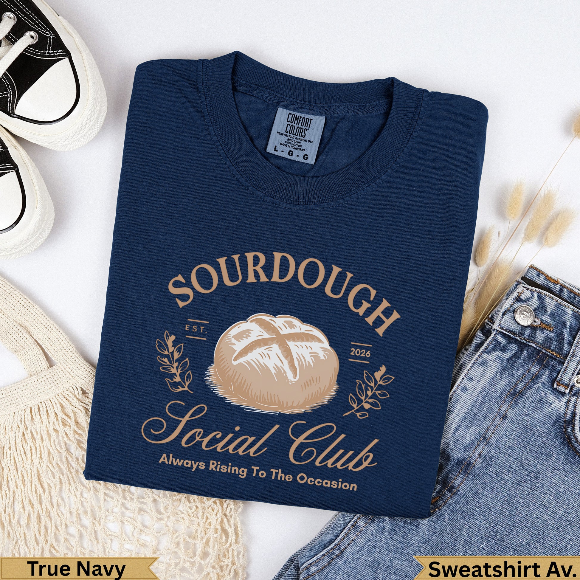 Navy blue sweatshirt with "Sourdough Social Club" text and a bread graphic.