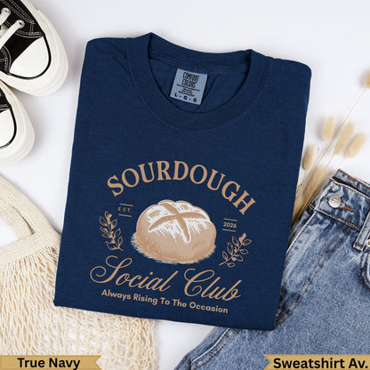 Navy blue sweatshirt with "Sourdough Social Club" text and a bread graphic.